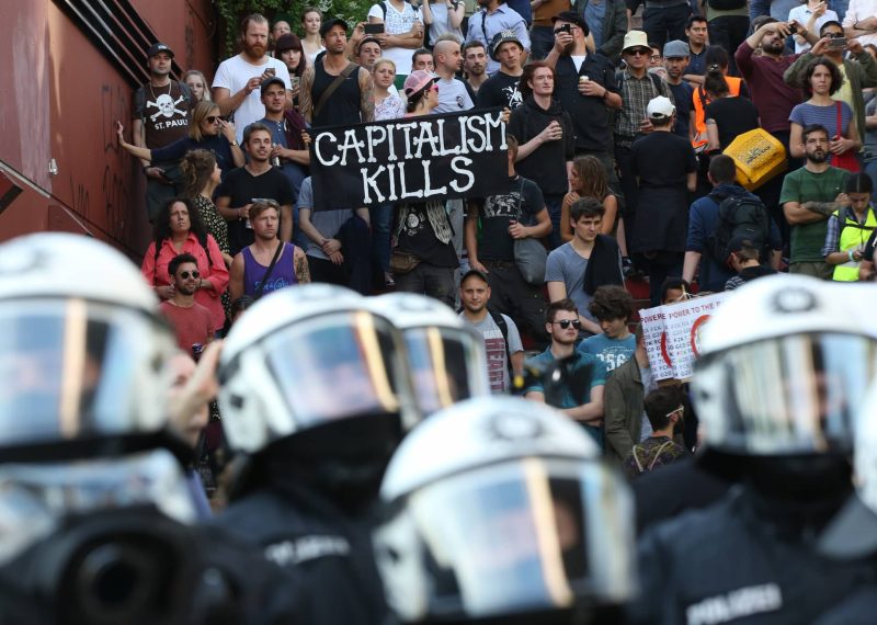 Police officers in operation during a protest against the upcoming G20 summit in Hamburg, Germany, Thursday July 6,  2017.  The leaders of industrialised nations, G20, are holding a two day summit starting Friday in Hamburg.  ( Bodo Marks/dpa via AP)