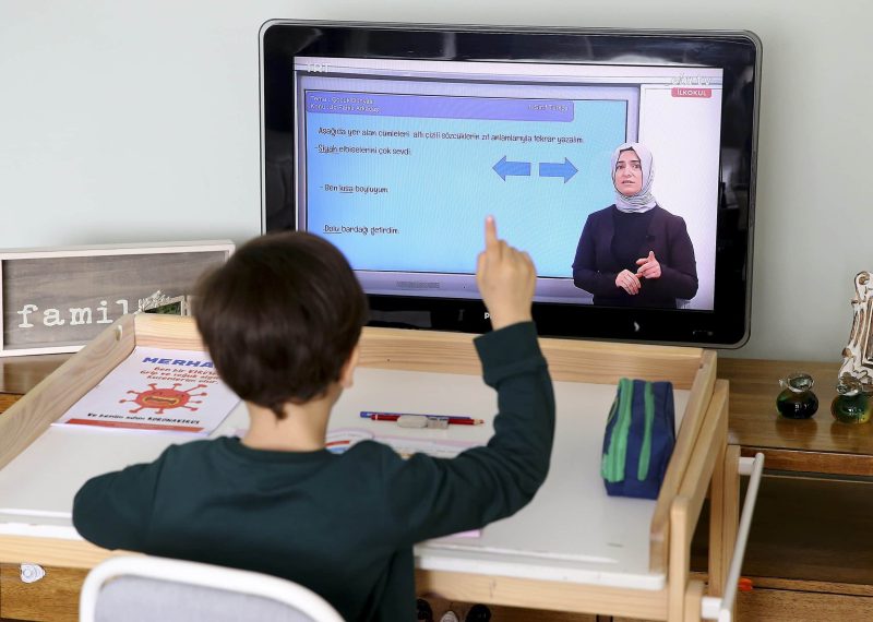 ANKARA, TURKEY - MARCH 23: A student watches his lecture from the TV within the distance education program, on March 23, 2020 in Ankara, Turkey. Turkey began airing broadcast school lessons on Monday as part of distance learning measures to prevent the spread of novel coronavirus. The remote lessons will be available online and on TV. Students will also be able to watch the lessons later in the evening, and they will also be available on the EBA website.


 ( Volkan Furuncu - Anadolu Agency )