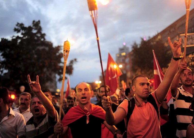 Supporters of ultra-nationalist groups shout slogans during a protest against recent Kurdish militant attacks on Turkish security forces, in Istanbul, Turkey, September 8, 2015. Kurdish militants killed 15 police officers in two bomb attacks in eastern Turkish provinces on Tuesday, a government official said, widening a conflict with the Turkish state. More than 40 Turkish warplanes hit Kurdistan Workers Party (PKK) targets overnight in northern Iraq, where the group has bases, in response to Sunday's killing of 16 soldiers near the Iraqi border, the deadliest attack since a two-year-old ceasefire ended. Tuesday's bombing in Igdir province that killed 14 police officers in a minibus was the latest in a daily stream of attacks by the PKK on soldiers and police in eastern Turkey since fighting resumed in July. A separate bomb attack in southeastern province Mardin killed one police officer and wounded three others. REUTERS/Yagiz Karahan  - RTX1RPA8