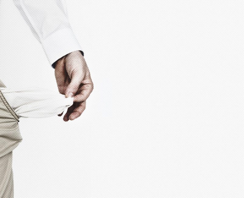 Unemployed man with empty pockets due to coronavirus economic impact